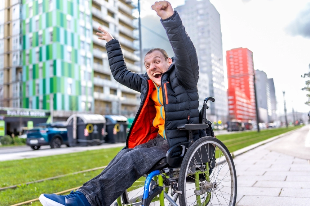 young disabled men with down syndrome disability enjoying his day out